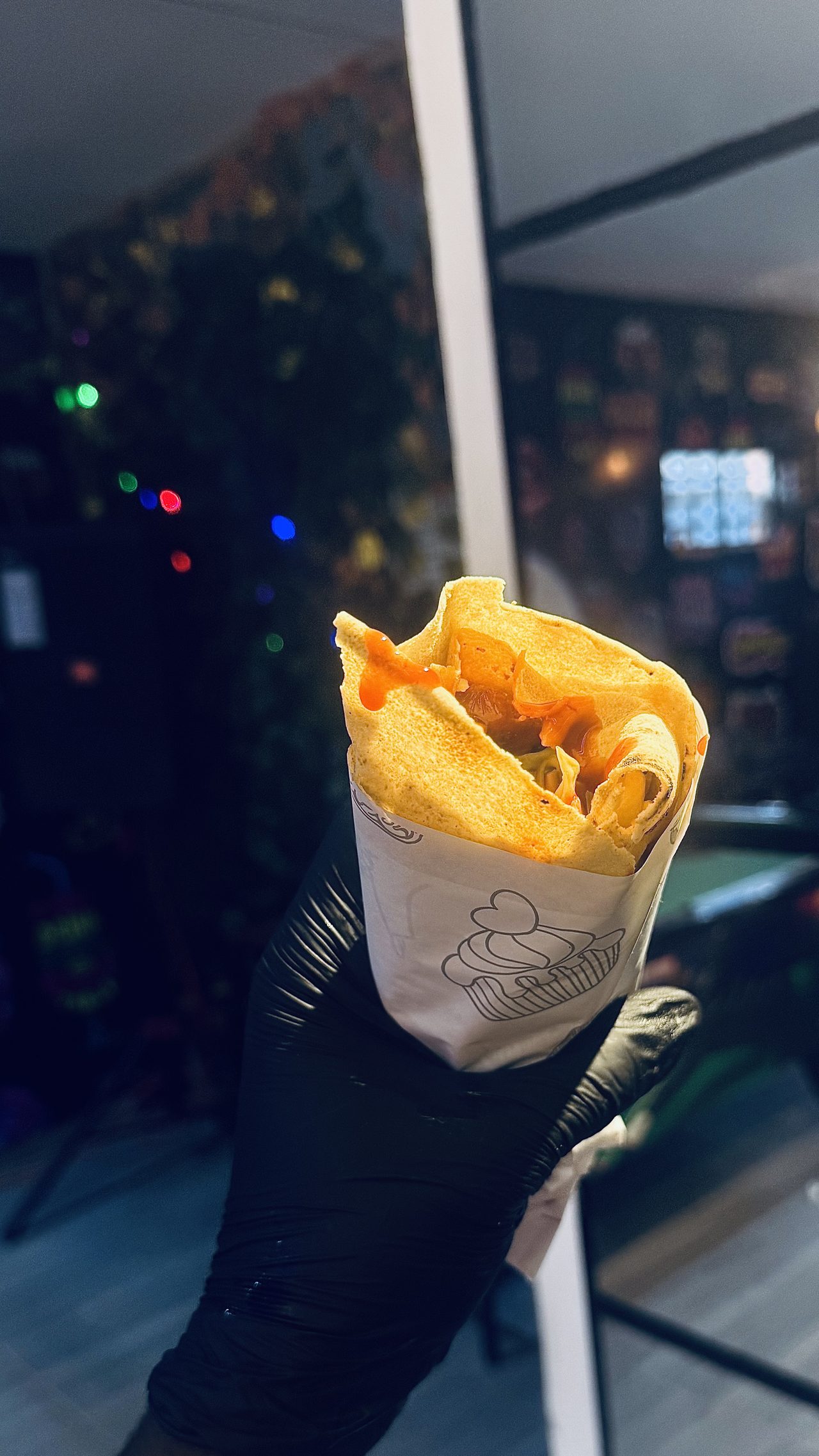Fresh shawarma wrap served in paper at the bar